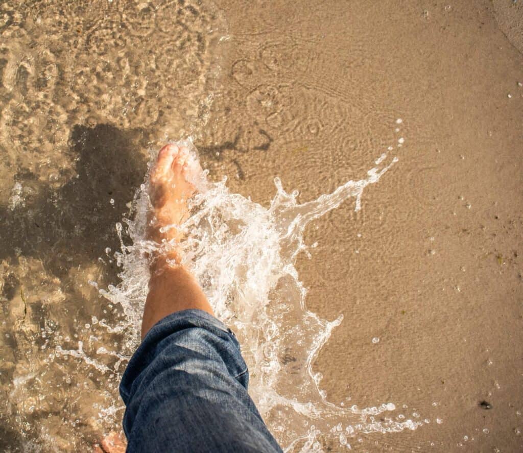 A persons' feet in water